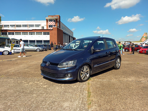 Morón, Argentina - Apr 7, 2024: Black 2000s Volkswagen Fox Highline hatchback at a classic car show in an airfield. Copy space