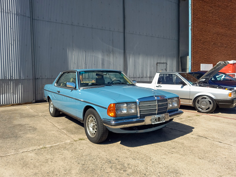 Morón, Argentina - Apr 7, 2024: Blue Mercedes Benz 280 CE coupe 1976 - 1986 at a classic car show in an airfield. Copy space