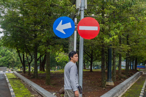 istock Man look to the sign direction traffic. 2148546185