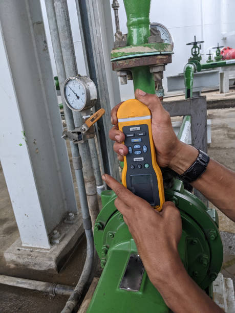 istock Man worker measure vibration motor and pump on power plant project. 2148546320