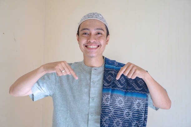 istock Moslem Asian man pointing the link gesture when Ramadan celebration. 2148546389