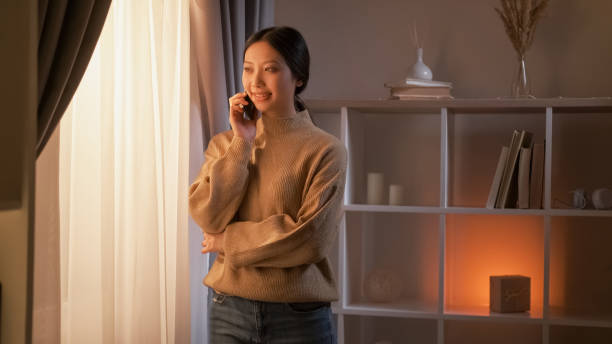 istock Mobile communication happy woman pleasant talk 2148548996