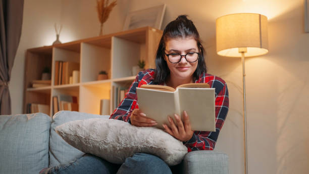 istock Book leisure reading woman home rest peaceful 2148549001