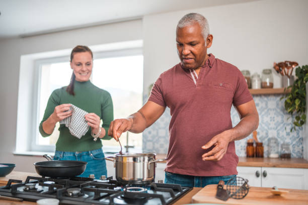 istock Mature Multi-Ethnic Couple Celebrates Love through Cooking 2148549492