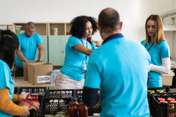 istock Volunteers arranging food donations 2148549526