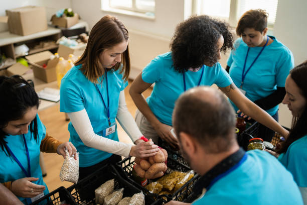 istock Many volunteers make light work of packing groceries 2148549542