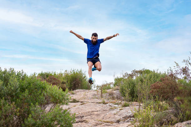istock Young man running a race in the mountains 2148550328