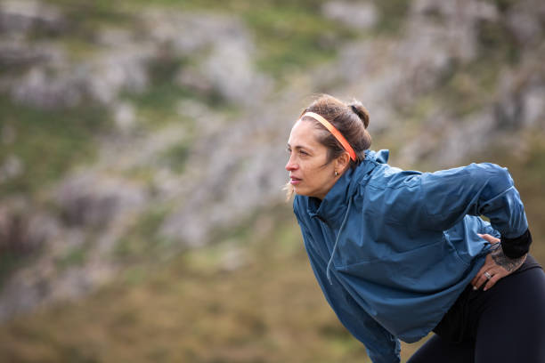 istock Tired young woman during a mountain run 2148550535