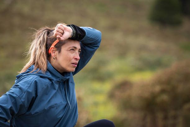 istock Tired young woman during a mountain run 2148550544