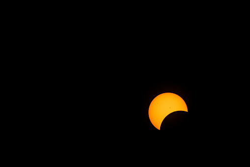 Moon begins passing over the sun in C1 phase of the 2024 Total Solar Eclipse; Indiana, USA