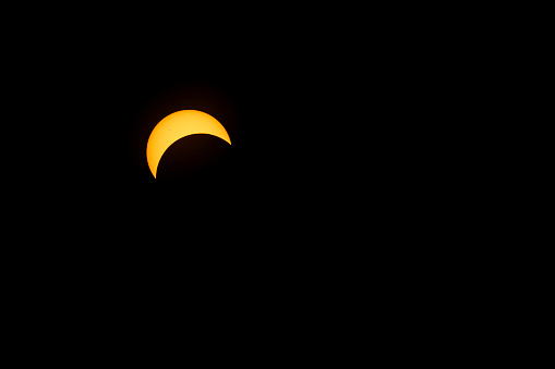 Sun shrinking as the moon covers it, approaching C2 phase of the 2024 Total Solar Eclipse; Indiana,