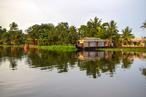 Alappuzha houseboats, also known as kettuvallams, are traditionally built cargo boats that have been transformed into luxurious floating cottages. They are a popular tourist attraction in Kerala, India, and offer a unique way to explore the state's scenic backwaters.

These houseboats are typically made of wood and have thatched roofs. They are decorated with colorful paintwork and carvings. Houseboats come in a variety of sizes, from small, one-bedroom boats to large, multi-bedroom vessels.  They typically have a living area, a kitchen, a bathroom, and one or more bedrooms. Some houseboats even have air conditioning and balconies.