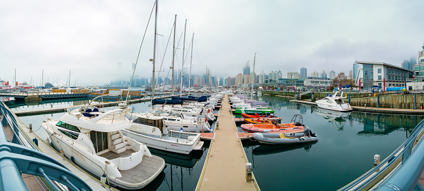 Qingdao,Shandong,China-Apr.13.2024:The Qingdao Olympic Sailing Centre Marina is located at the former Beihai dockyard in FuShan Bay adjoining May Fourth Square and DongHai West Road