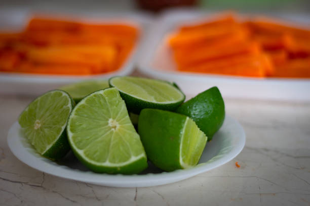 Preparation of healthy smoothie at home. Avocado, lemon, spinach, celery. Self-care. Health and wellbeing.