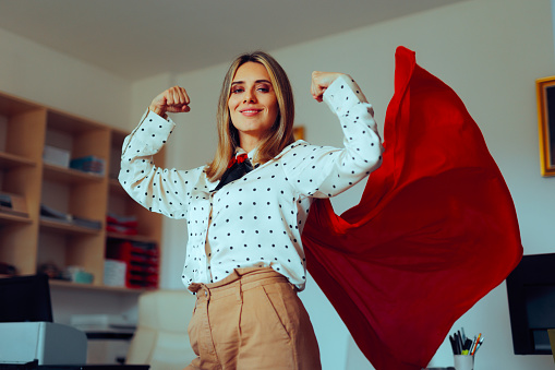 Super heroine businesswoman showing strength and confidence