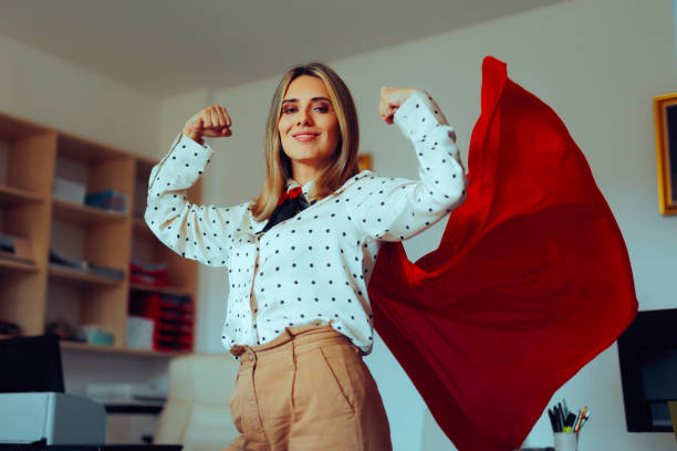 Strong Superhero Manager Feeling Powerful and Invincible Super heroine businesswoman showing strength and confidence unyielding stock pictures, royalty-free photos & images