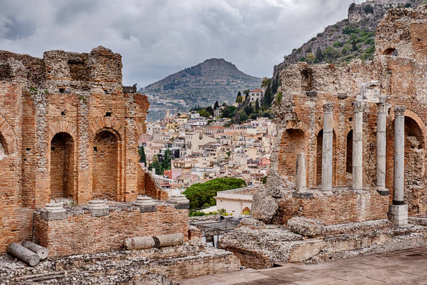 A view of the village of Taormina, Sicily as seen through a gap in the ruins of the ancient Roman theatre.