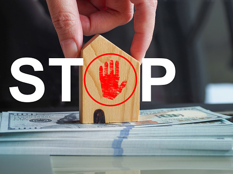Stop buying, selling or investing in houses or real estate. Problems from interest or economic conditions