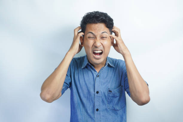 istock Young handsome man over isolated background suffering from headache desperate and stressed because pain and migraine. Hands on head. 2148567968