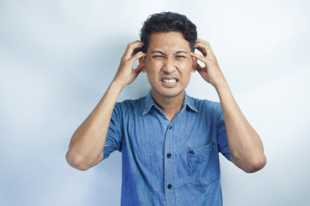 istock Young handsome man over isolated background suffering from headache desperate and stressed because pain and migraine. Hands on head. 2148568000