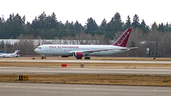 Omni Air International, Boeing 767 aircraft, taxiing to the terminal at Seattle-Tacoma International Airport in December 2022.
Omni Air International is a private International airline.