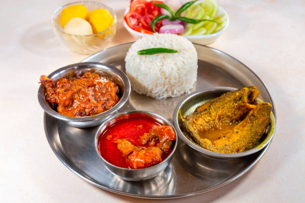 istock Bengali non-veg lunch thali with plain rice, vegetables, and fish 2148568539
