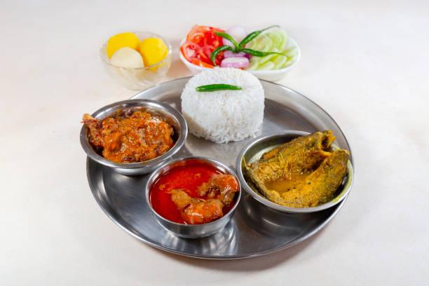 istock Bengali non-veg lunch thali with plain rice, vegetables, and fish 2148568591