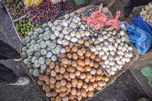 Different kinds of eggs on display at a market stall at the famous food market in Berastagi in North Sumatra