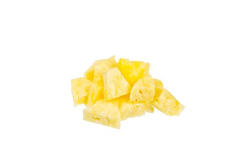 A pile of pineapple pieces. Isolated on white background. Ananas comosus