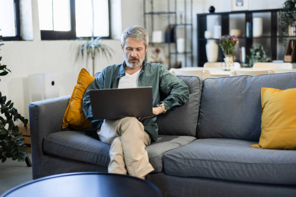 istock Mature man working from home online 2148573022