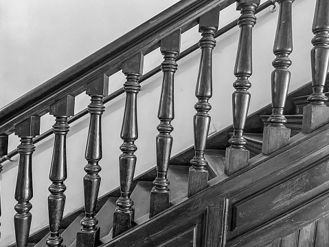 Ornate wooden staircase and bannister
