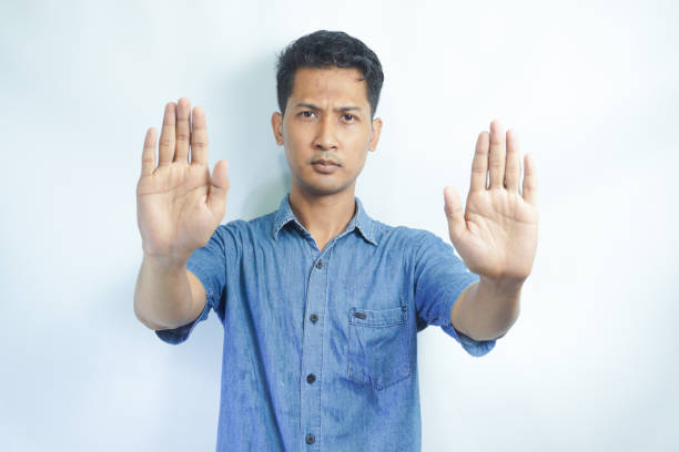 istock Attractive young asian man on isolated white background scared and terrified with frightened expression stop gesturing with hands, screaming in shock. Panic concept. 2148575370