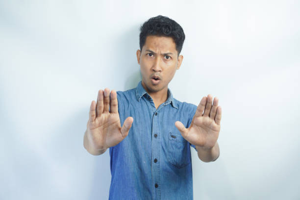 istock Attractive young asian man on isolated white background scared and terrified with frightened expression stop gesturing with hands, screaming in shock. Panic concept. 2148575666