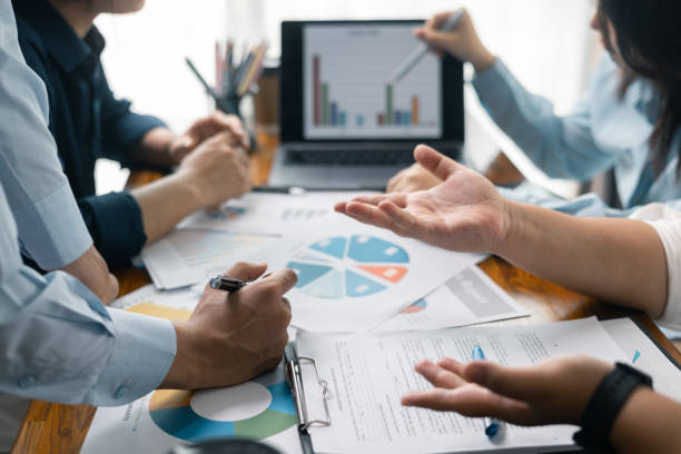 istock Financial analyst presented a detailed data analysis graph to their colleague, corporate office, demonstrating the business's financial status and trends. Concept of business data analysis. 2148575989