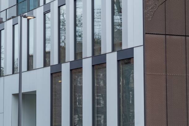 istock facade of an modern large house ,wall with windows 2148576489