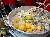 Traditional dish consists of fish dumpling, egg, tofu, cabbage and potato