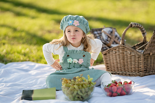 Little girl out on a picnic in the park