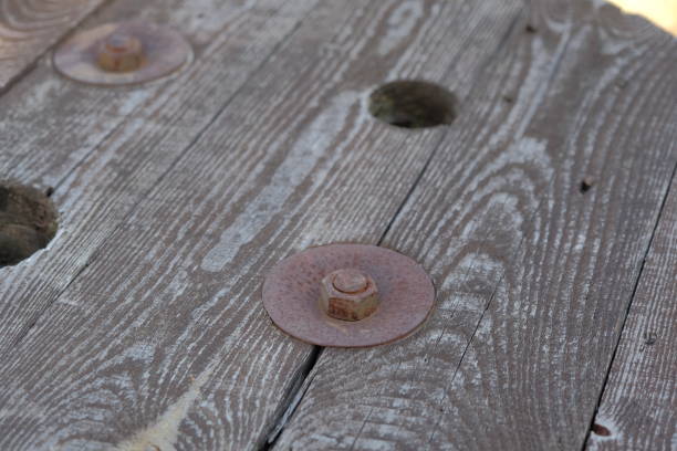 istock rusty metal bolt. rusty metal bolt and nut on wooden surface 2148580914