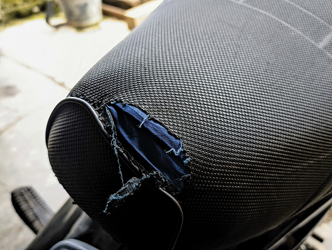 Motorcycle seats with holes in the upholstery. Repair and maintenance on motorcycles
