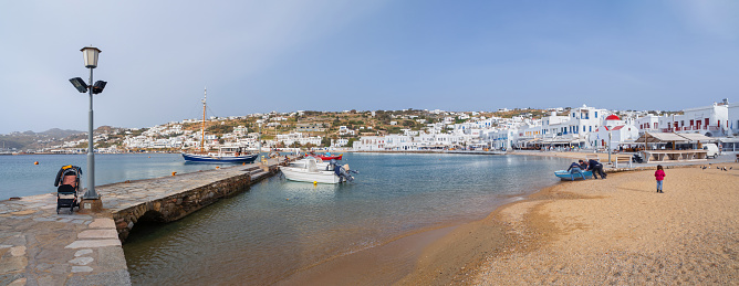Mykonos, Greece. March 29, 2024:  Panoramic view of Chora of Mykonos with tourists