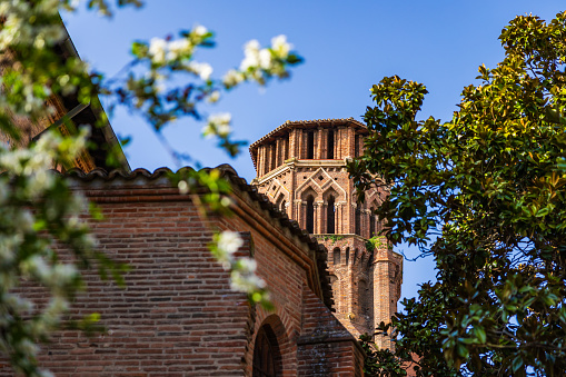 Bell tower in red bricks of the Church of the Augustins in Toulouse