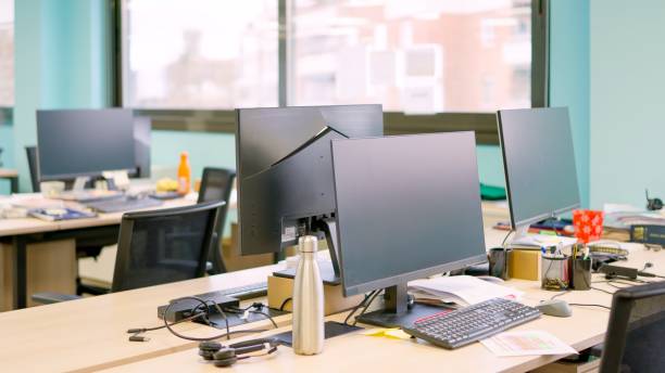 istock Coworking space with laptop empty of people 2148582885