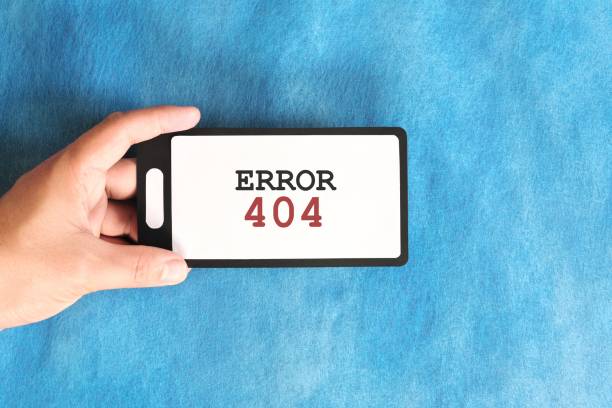 istock Hand holding a mobile phone with Error 404 or page not found display notice. 2148585329