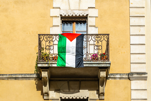 Palestinian flag on the balcony of an old house in Geneva
