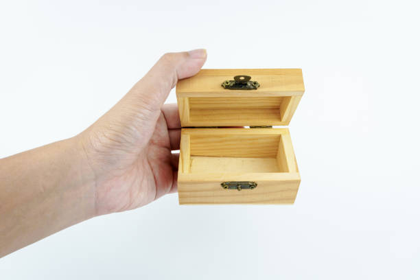 istock hand holding small wooden box on white background. 2148587018