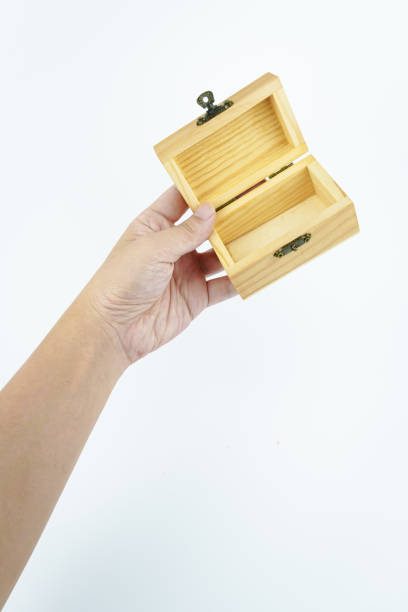 istock hand holding small wooden box on white background. 2148587019