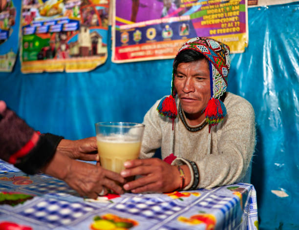 istock A Peruvian lady of the Quechua ethnic group serves the drink called chicha in a typical chicheria in Pisac in the Cusco region 2148587175