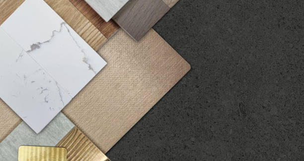istock group of interior material samples including brushed gold stainless, bronze laminated, stone tile, wooden flooring tile, white marble quartz, veneer placed on black stone table in top view. 2148587282