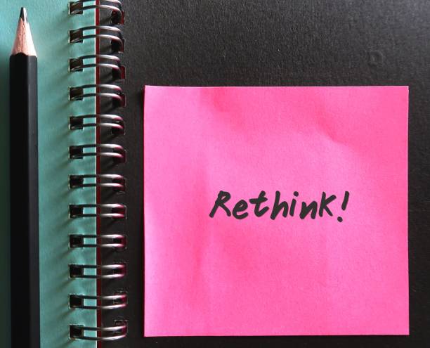 istock Pink note with handwriting text RETHINK!concept of a reassessment, especially one that results in changes being made 2148588082