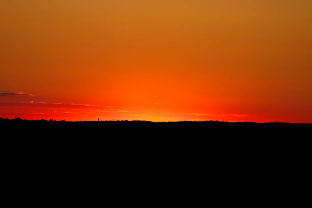 The sun has just gone below the horizon and shares the light